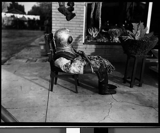 [Sponge Diver's Suit in Front of Mermaid Curio Shoppe, Florida]