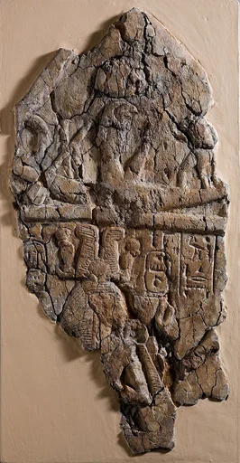 Fragment of Stela depicting a figure labeled 'excellent spirit of Re'  facing Ramesses I and  Ahmose-Nefertari beneath the barque of Re