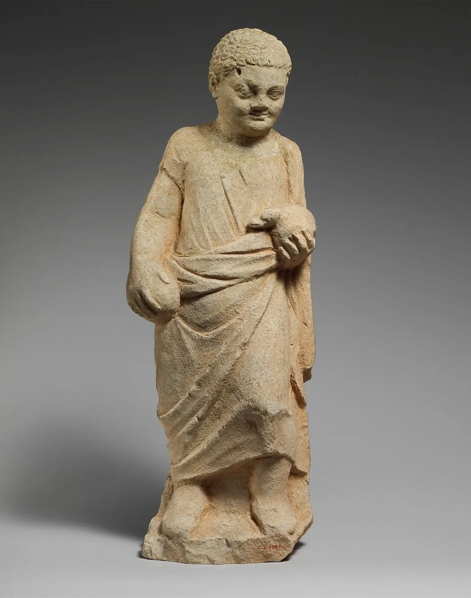 Limestone statuette of a boy holding a duck — Unknown