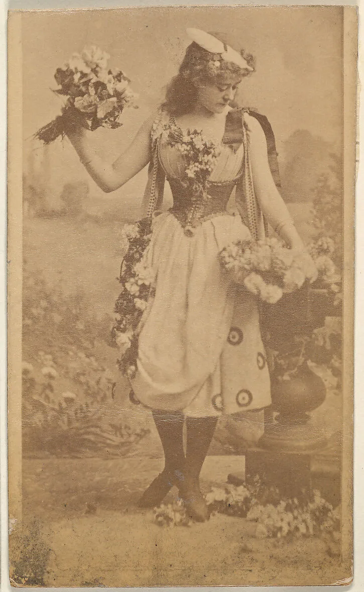 Actress holding bouquet of flowers, from the Actresses series (N668) — Unknown