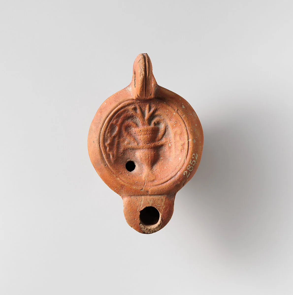 Terracotta oil lamp — Unknown