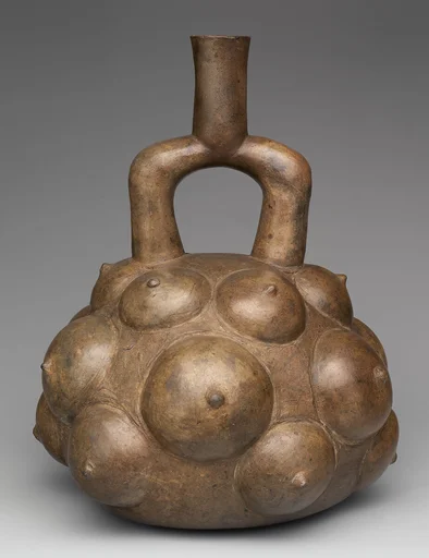 Stirrup-spout bottle with fruits