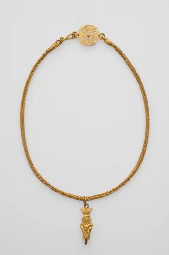 Braided chain with intricate openwork medallion at the clasp and a gold Bes pendant