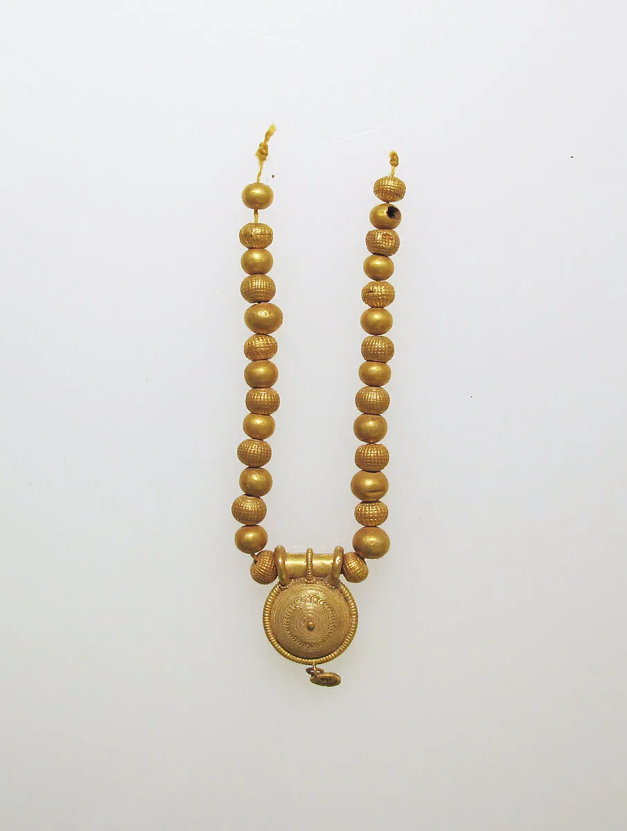 Necklace with bulla and gold beads — Unknown