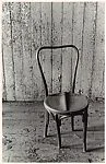 [Wooden Chair Before Wall with Peeling Paint]