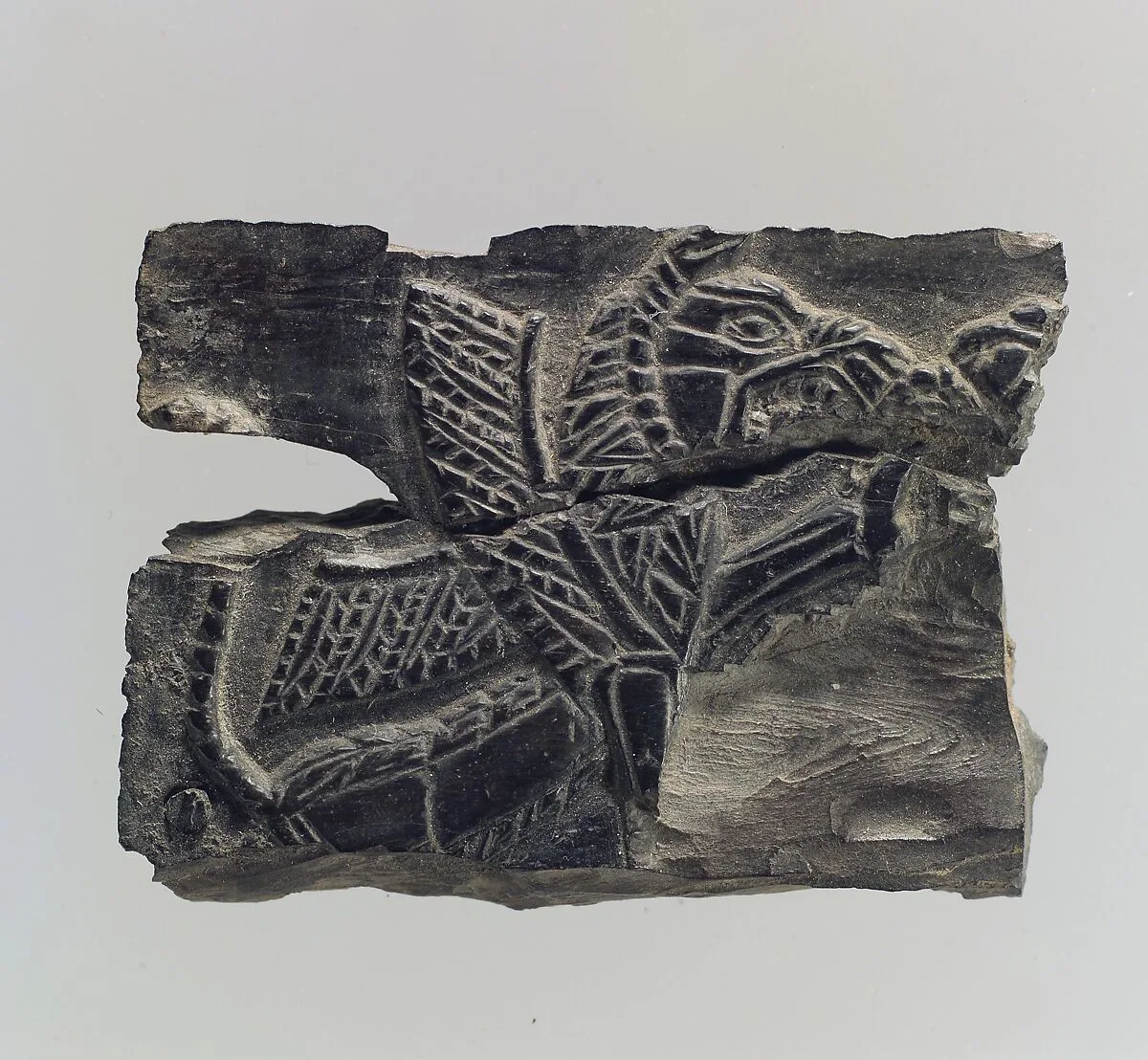 Plaque with a seated, winged leonine monster possibly with scorpion tail — Unknown