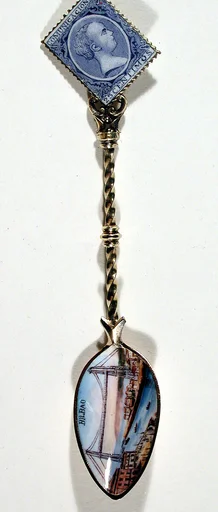Souvenir spoon with view of Bilbao harbor and tower bridge and finial in form of a postage stamp
