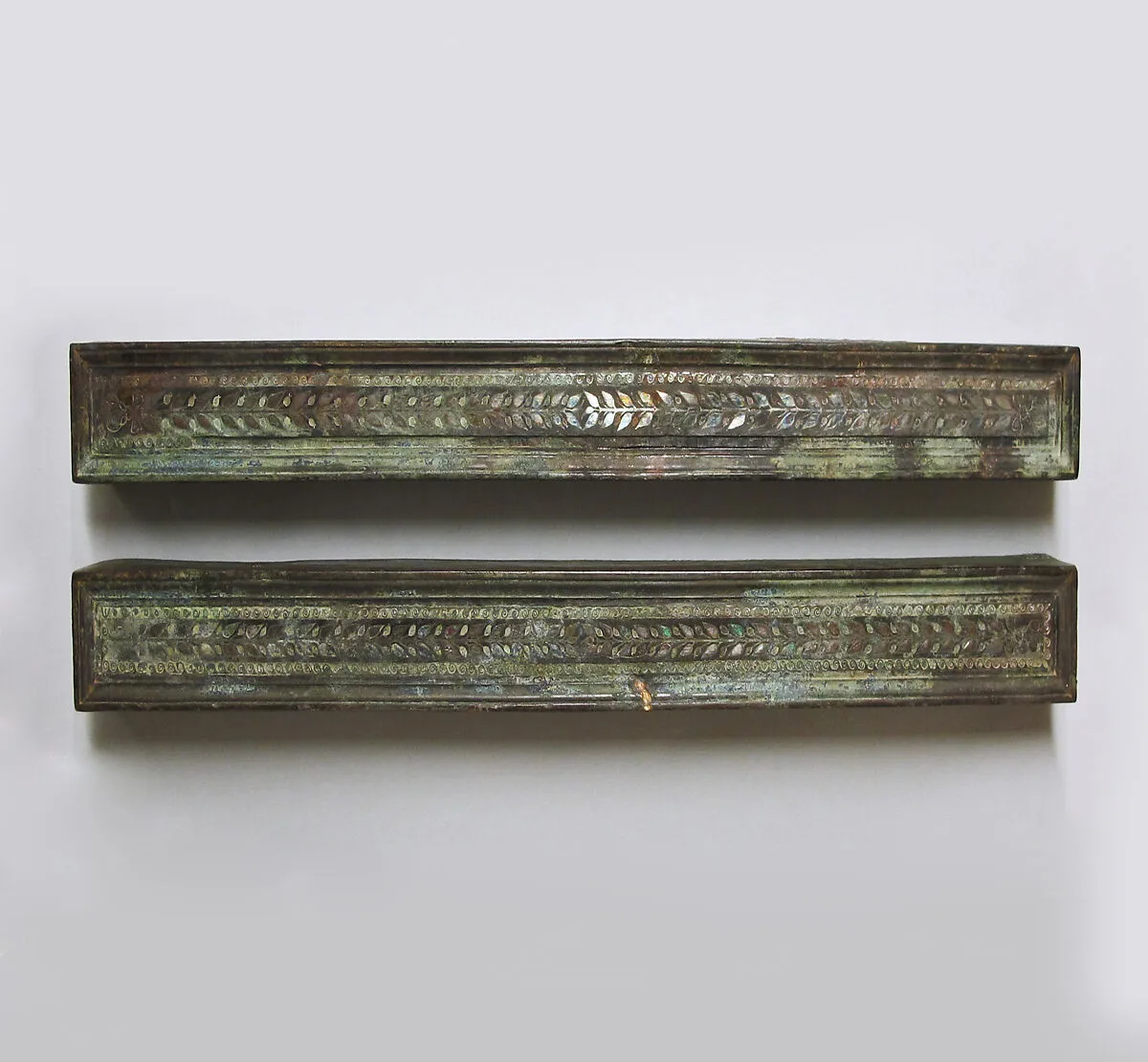 Bronze furniture attachments with silver inlay — Unknown