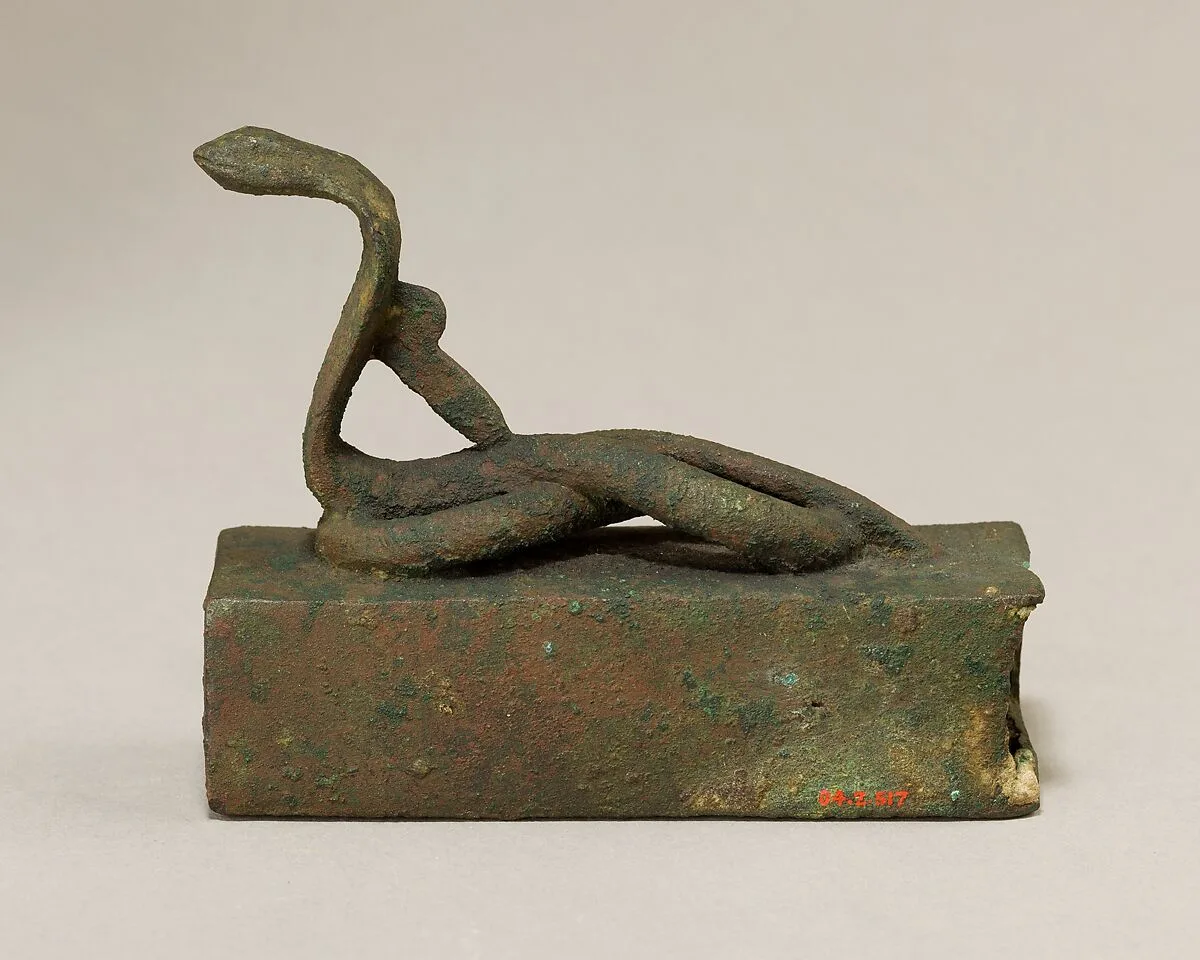 Box for an animal mummy surmounted by a coiled, rearing snake — Unknown