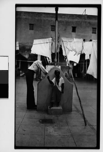 [Man at Communal Laundry in Courtyard, Havana]