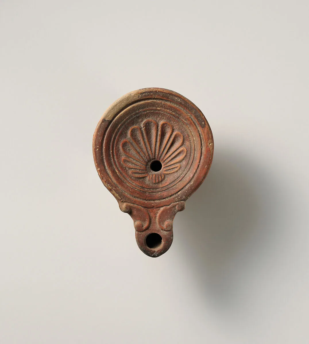 Terracotta oil lamp — Unknown
