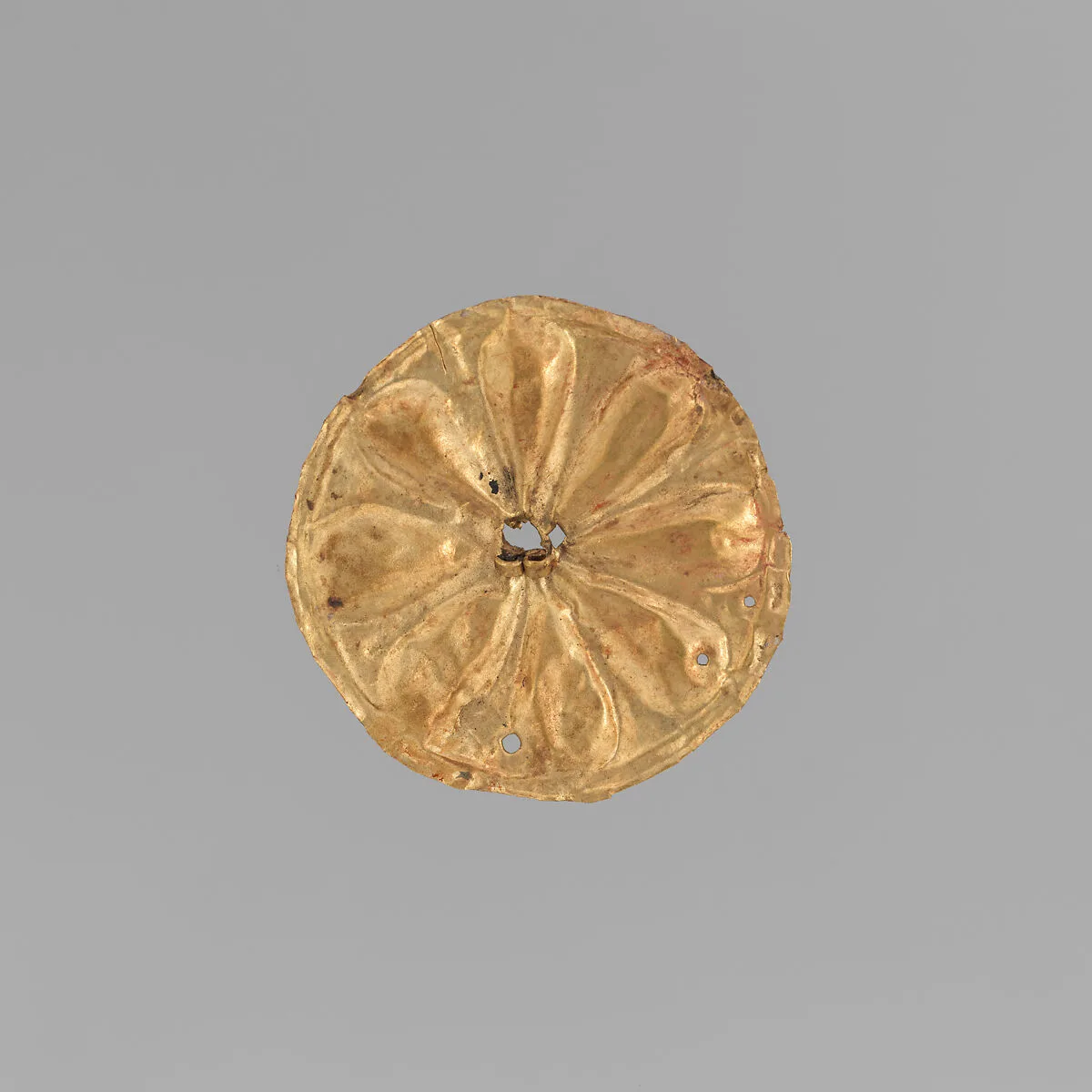 Gold roundel with stamped designs — Unknown
