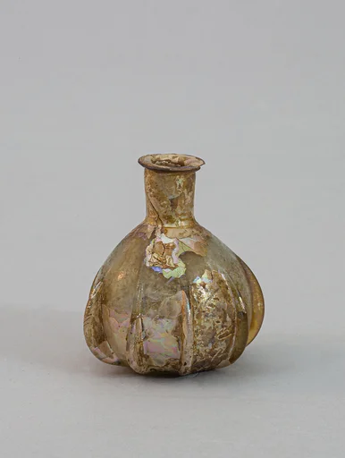 Glass ribbed perfume bottle
