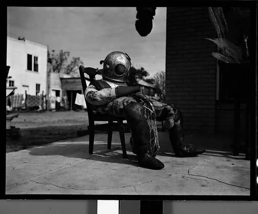[Sponge Diver's Suit in Front of Mermaid Curio Shoppe, Florida]