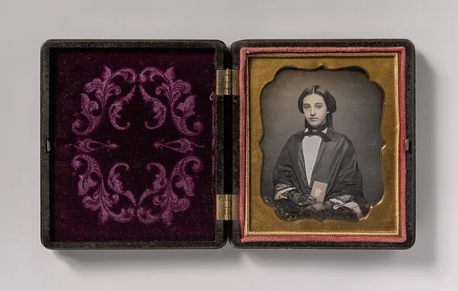 [Young Woman Wearing Lace Gloves Holding a Daguerreotype Case]