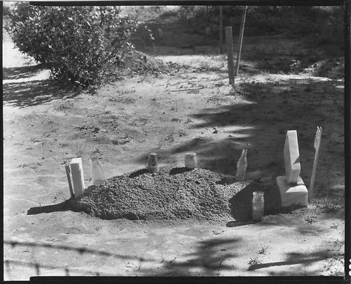 [Child's Grave with Bottles and Jars on Plot, Hale County, Alabama]
