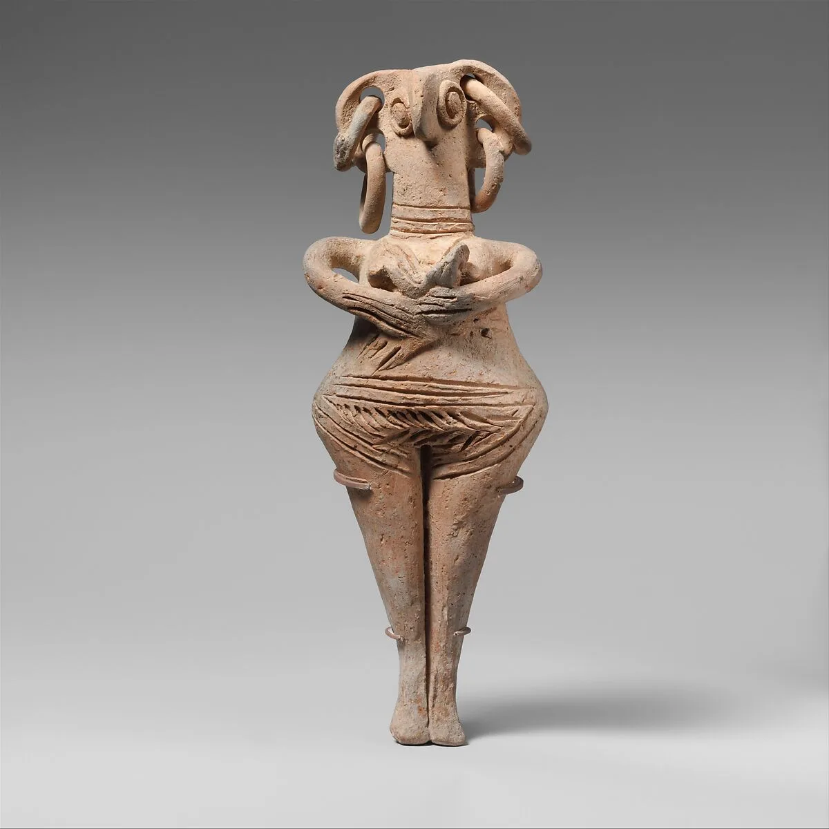 Terracotta statuette of woman with bird face — Unknown