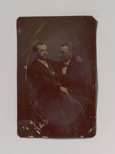 [Two Men Seated, One in the Other's Lap, with Their Hands in Suggestive Positions]
