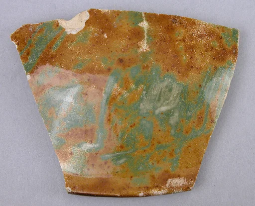 Fragment of a Lotus-Shaped Bowl with Luster and Green-Mottled Decoration
