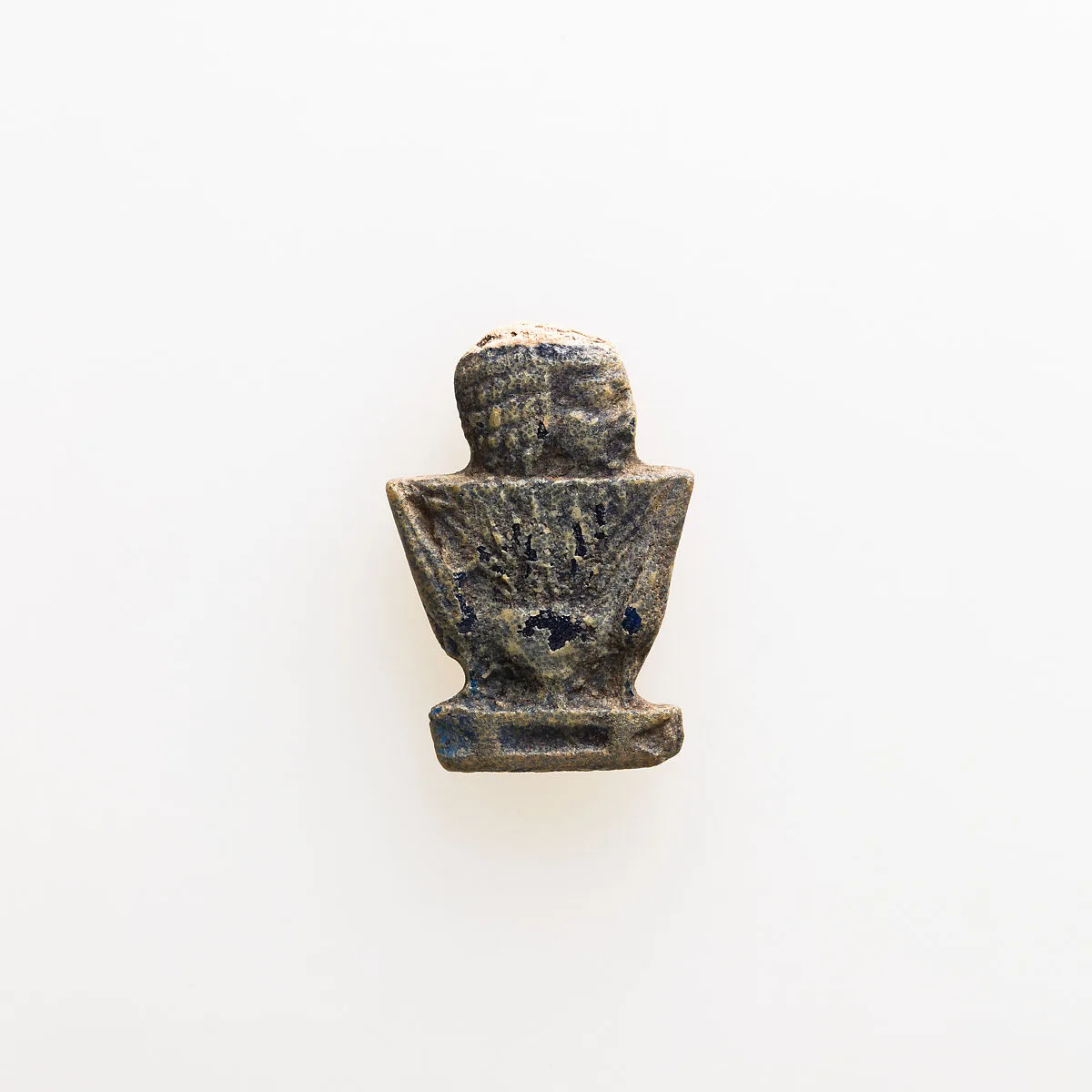 Amulet depicting human head emerging from lotus — Unknown