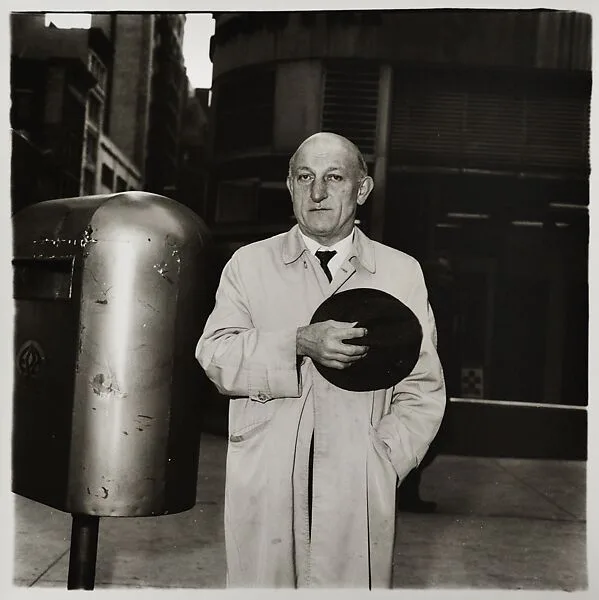Man at a parade on Fifth Avenue, N.Y.C. — Diane Arbus|Neil Selkirk