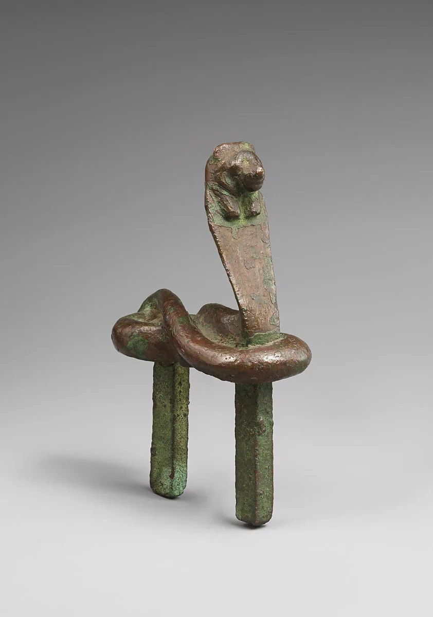 Figure of a rearing cobra with feline head — Unknown
