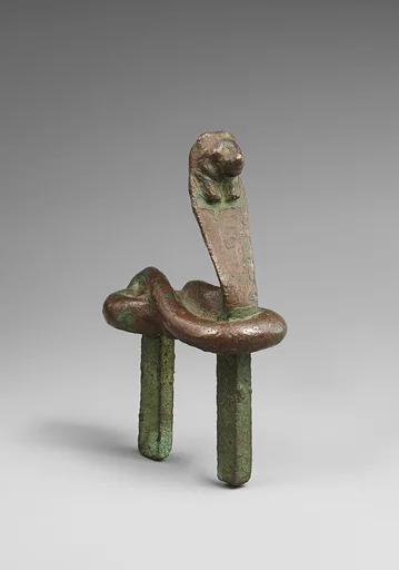Figure of a rearing cobra with feline head