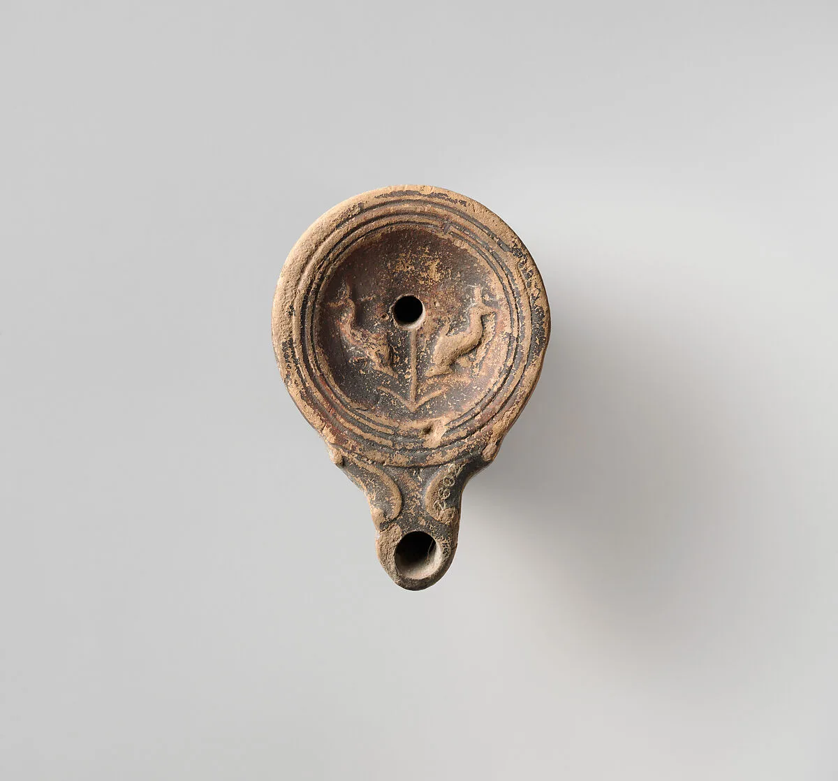 Terracotta oil lamp — Unknown