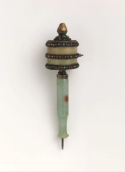Prayer Wheel and Xylographic Folio Page — Unknown