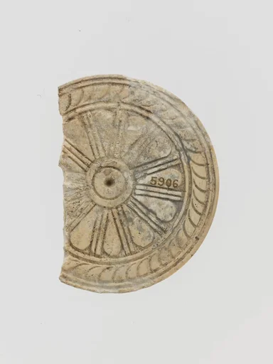 Ivory disk with rosette