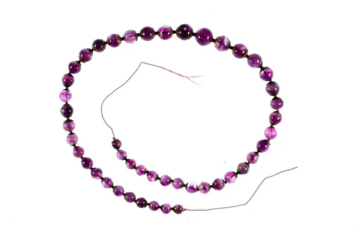 String of 46 round beads in graded sizes