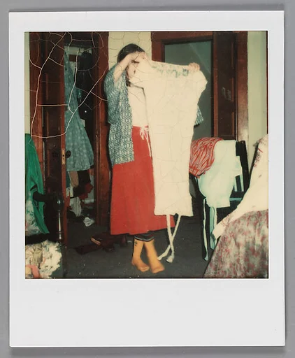 [Carla Steiger Holding a White Dress, Oberlin, Ohio]