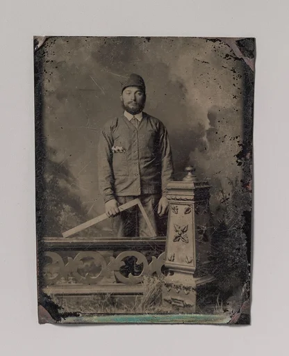 [Carpenter, Standing Behind a Decorative Balustrade, Holding a Square]