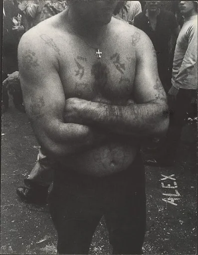 [Shirtless, Tattooed Man with Arms Folded, on Street, New York]
