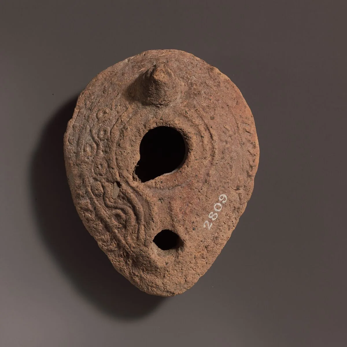 Terracotta oil lamp — Unknown