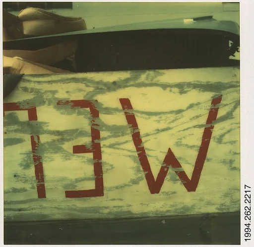 [Detail of Sign in Trash Heap: "MELONS", Destin, Florida]