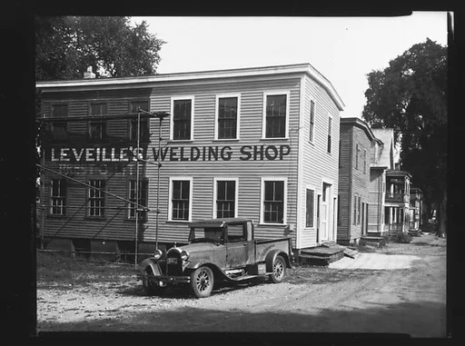 [Parked Car in Front of Leveille's Welding Shop, Near Boston, Massachusetts]