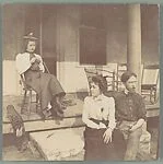 [Jessie Crane Evans and Walker Evans Jr. Seated Before Porch, with Unidentified Woman]
