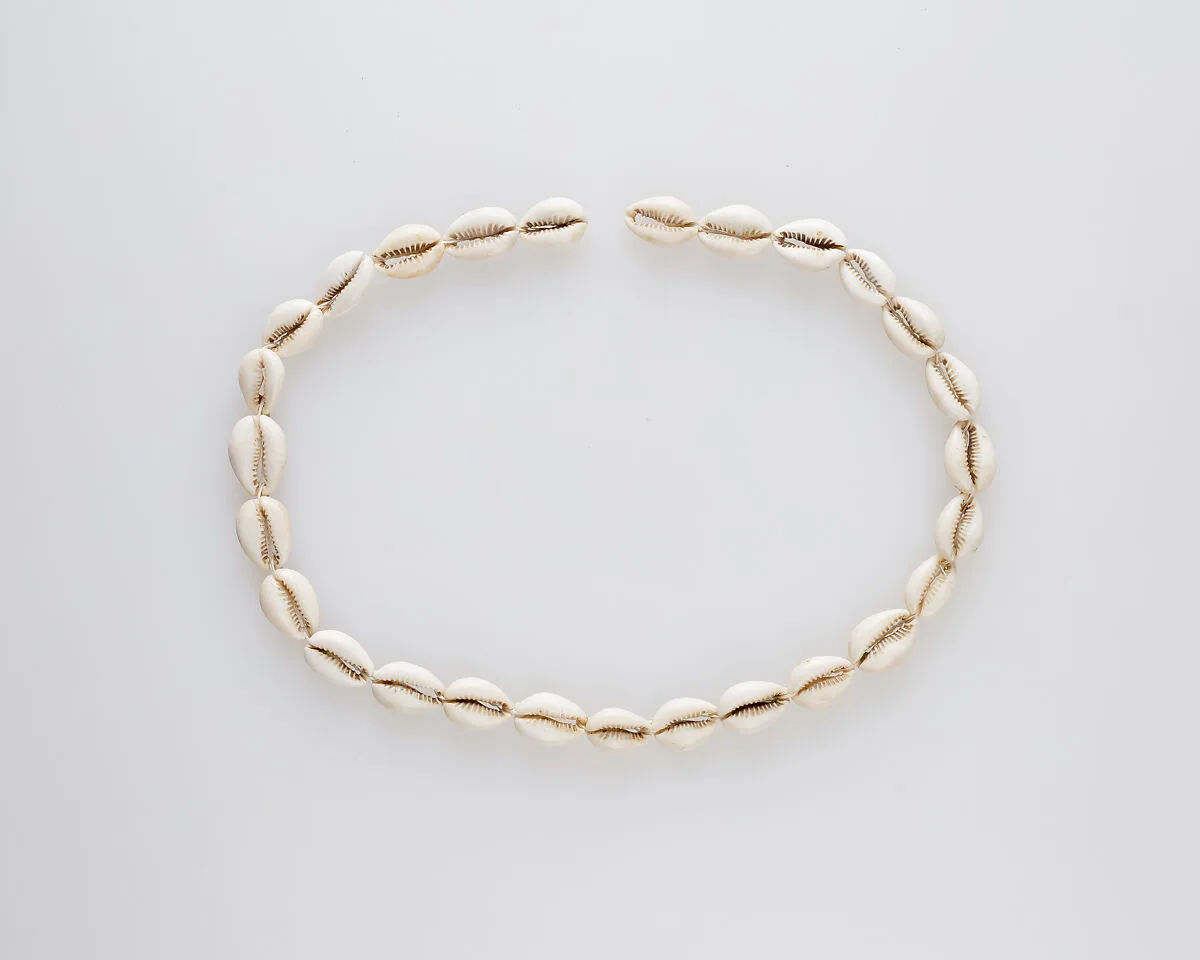 String of cowrie shells — Unknown