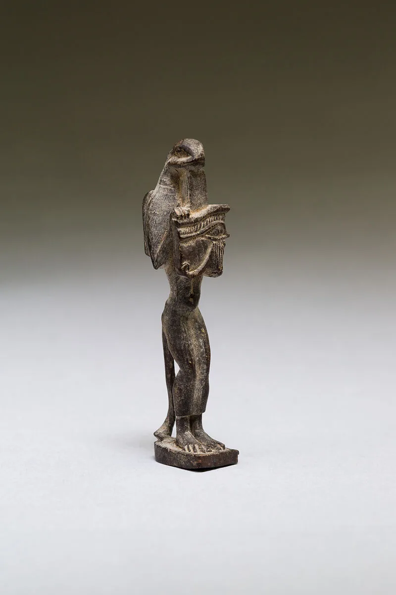 Nehebkau (snake deity) holding a wedjat eye — Unknown