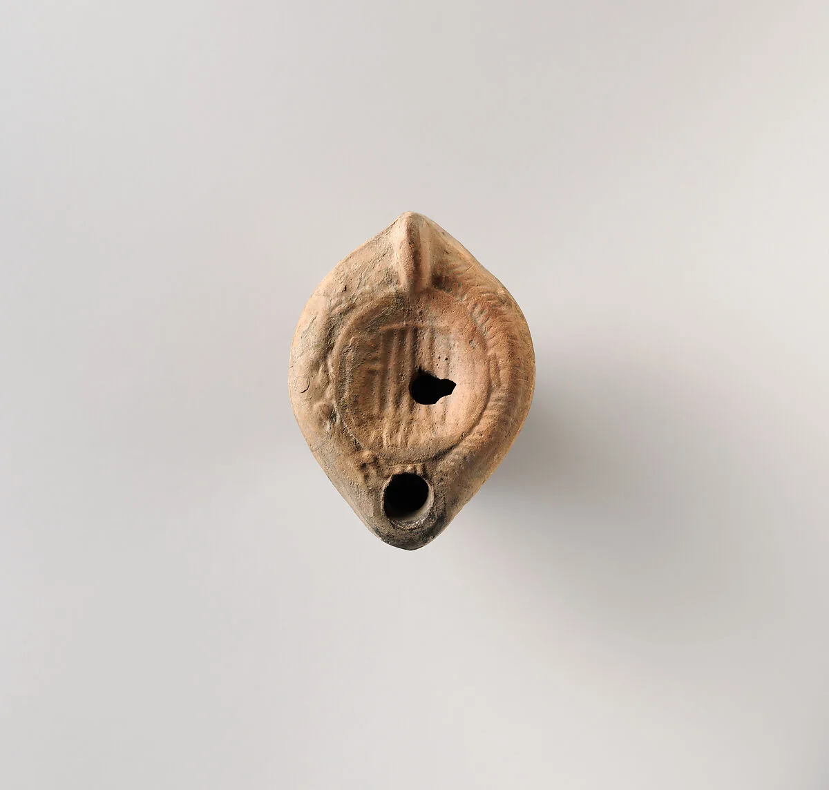 Terracotta oil lamp — Unknown