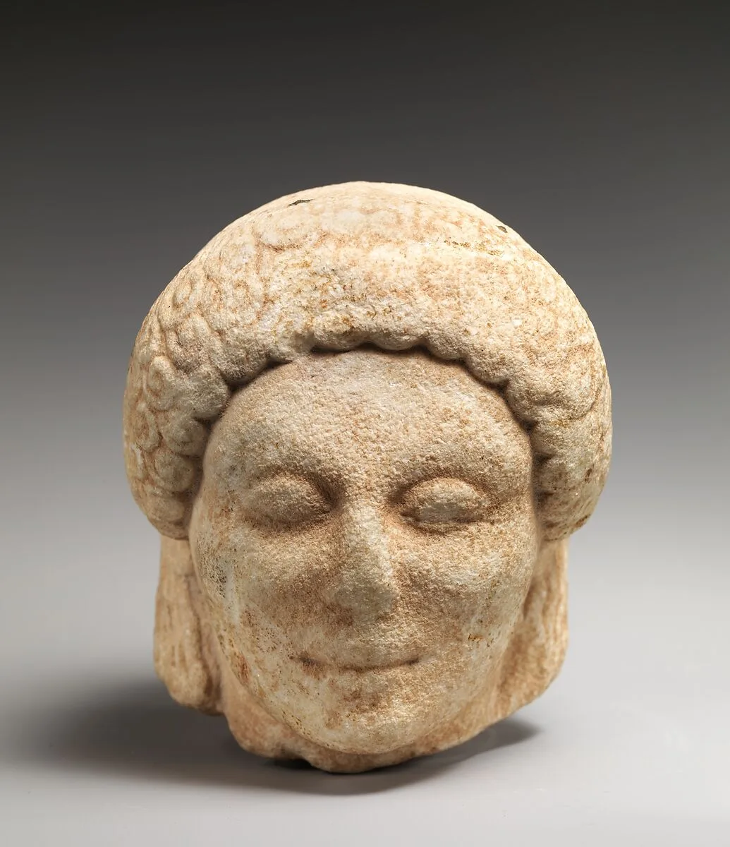 Marble head of a kouros (youth) — Unknown