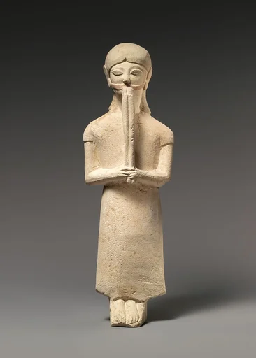 Limestone flute-player