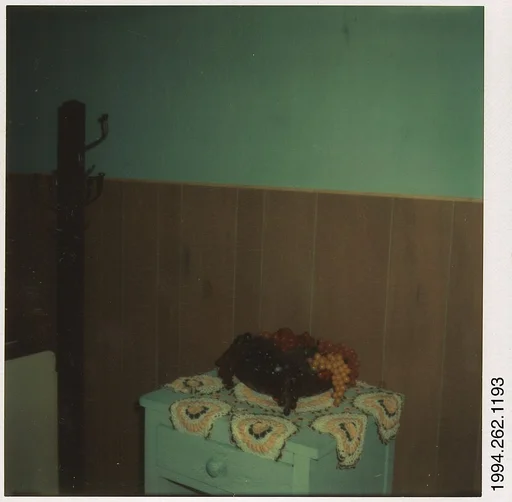 [Plastic Fruit Display on Doilies]