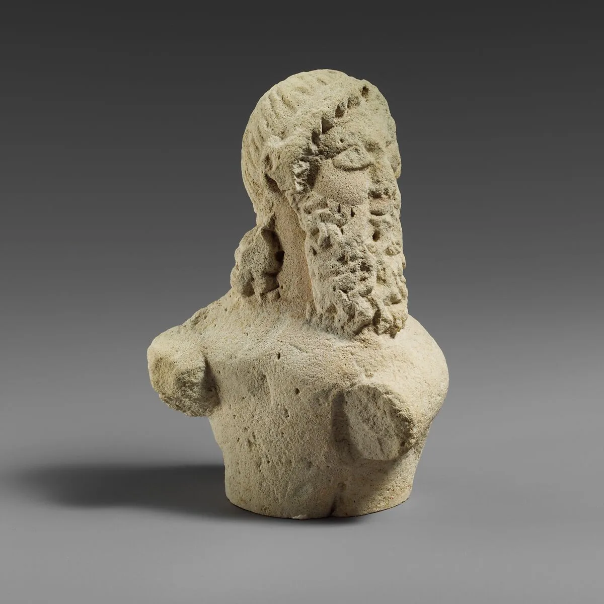 Fragment of a limestone statuette of a silen (?) — Unknown
