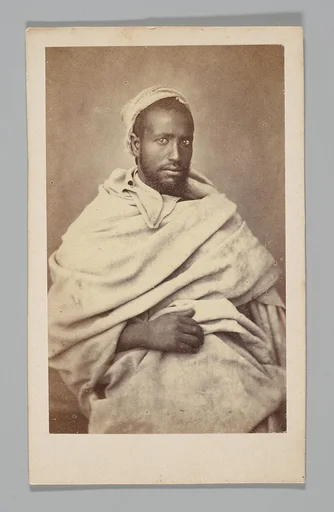 [Studio Portrait: Seated Man, Algeria]