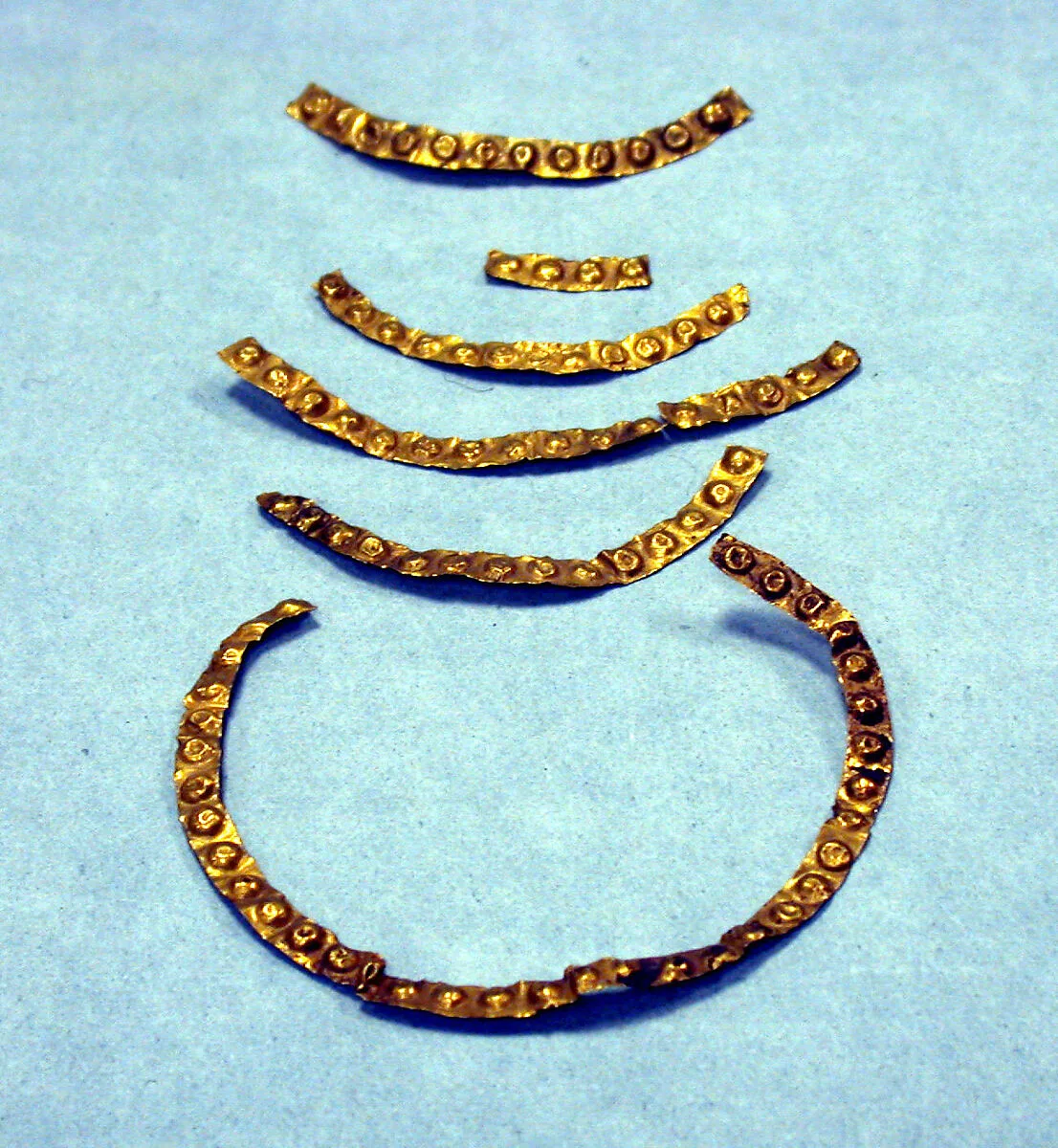 Seven Hammered Gold Strips — Unknown