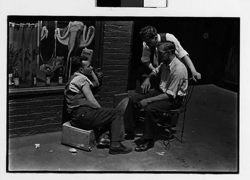 [Three 35mm Film Frames: Men on Sidewalk, and Construction Worker Lying on Boxes, New York City]