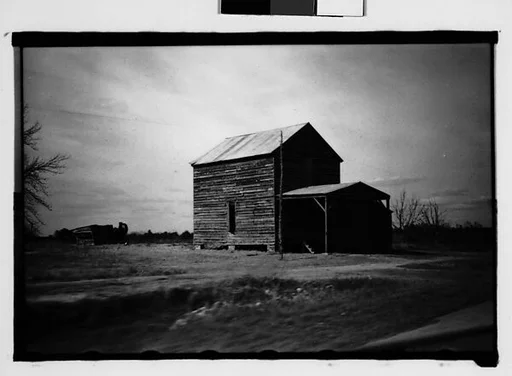 [Wooden Houses in Field, From Moving Automobile, Macon, Georgia]