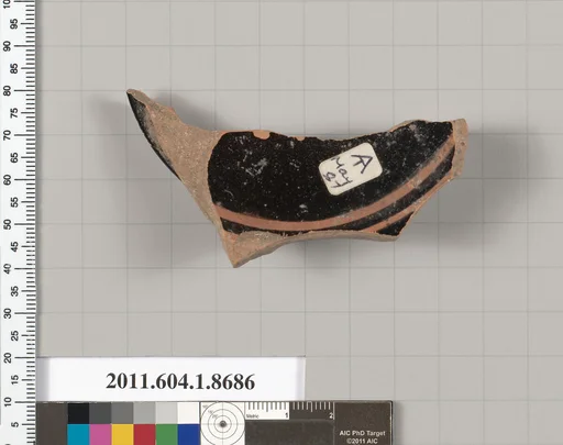 Terracotta fragment of a stemless kylix (drinking cup)